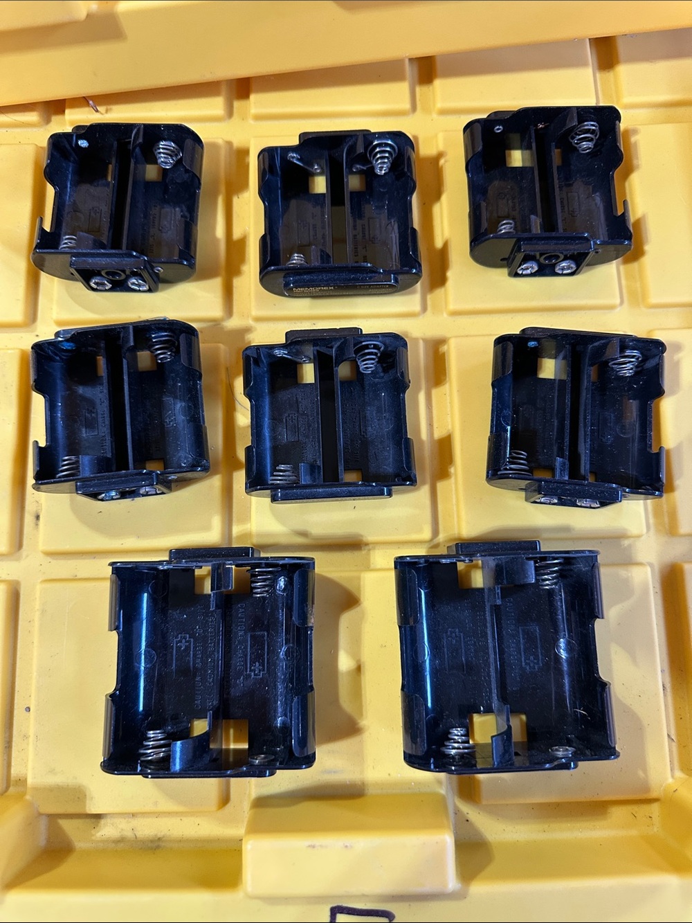 Battery trays and chargers for rechargeable batteries
